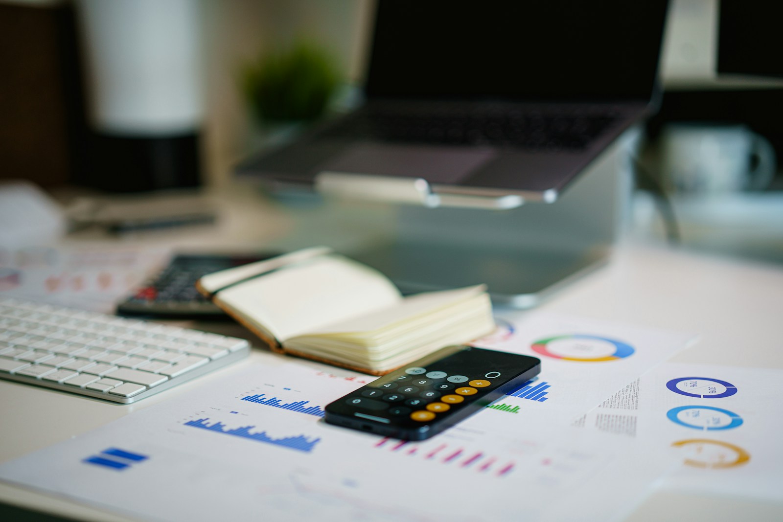 Calculator and financial statements showing how a condo master policy deductible is divided into a special assessment bill for each unit owner
