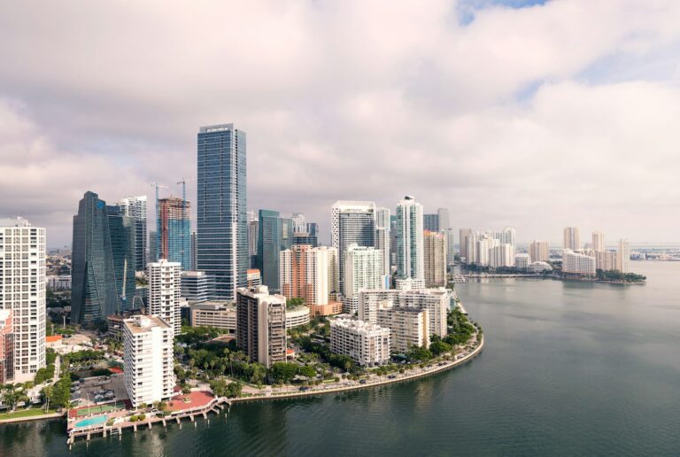 Aerial view of Miami and Brickell condo high-rise towers, illustrating condo warrantability and master insurance policy requirements in 2026