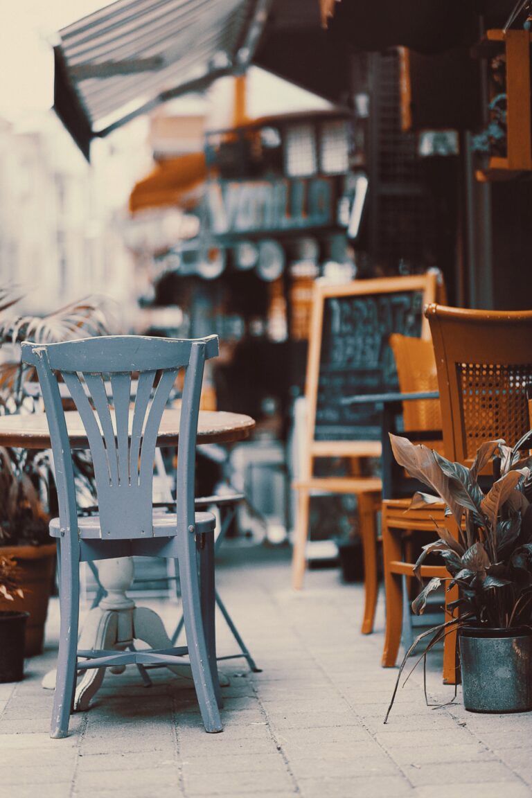 Quiet outdoor cafe patio with empty chairs, illustrating low-risk daytime hospitality venue