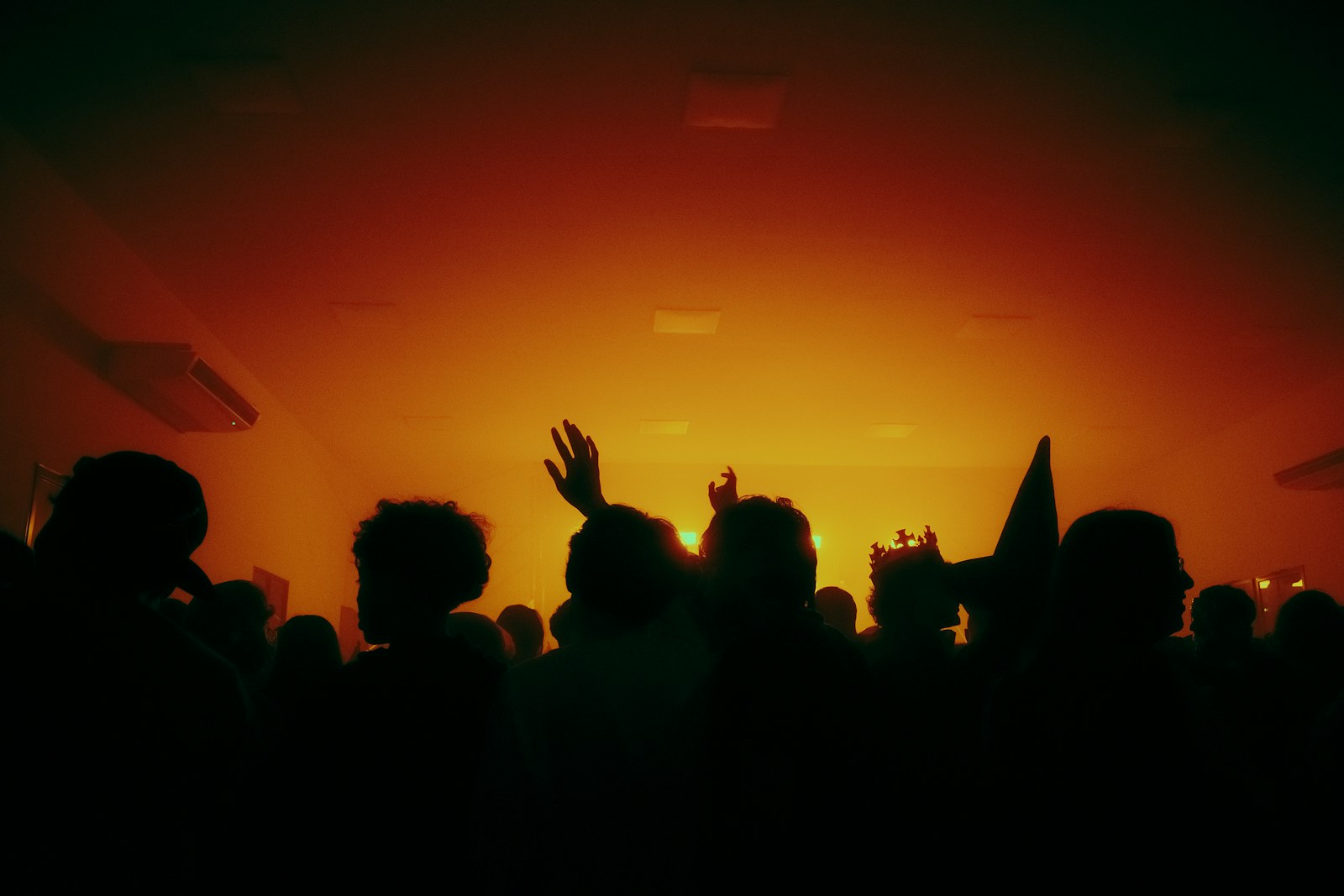 Dense crowd packed onto a nightclub floor at night, illustrating the crowd-related injury, assault-and-battery, and negligent-security exposures that peak at high-volume late-night venues