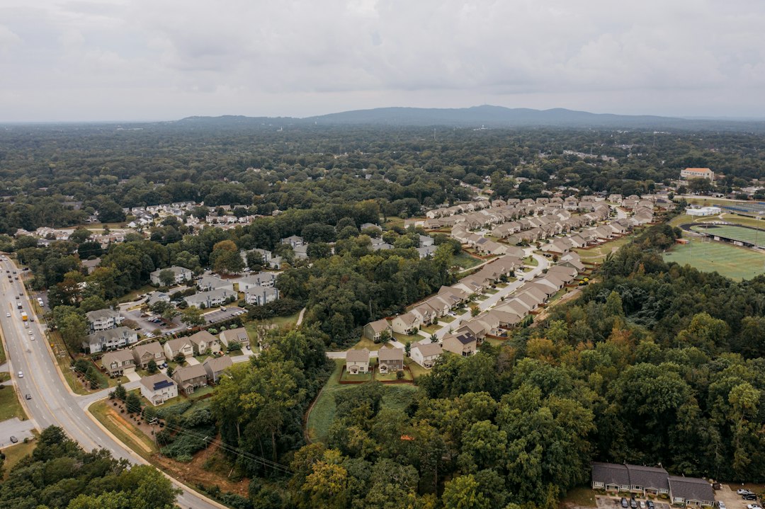 Aerial view of a tree-lined suburban neighborhood governed by a homeowners association