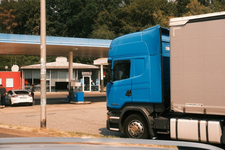 Blue semi truck parked at a fuel station, representing a new owner-operator preparing for a first load