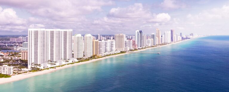 Aerial view of oceanfront condominium towers along the South Florida coast