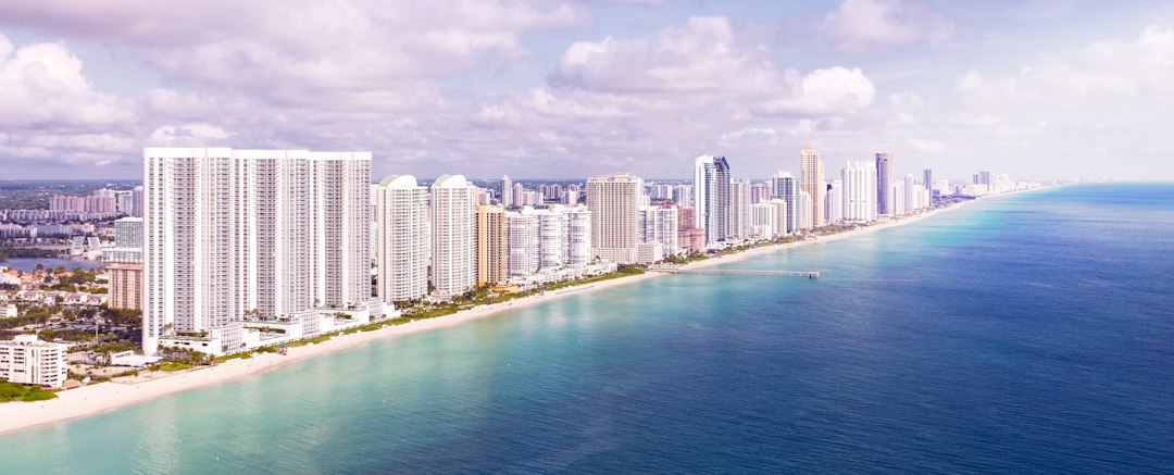 Aerial view of oceanfront condominium towers along the South Florida coast